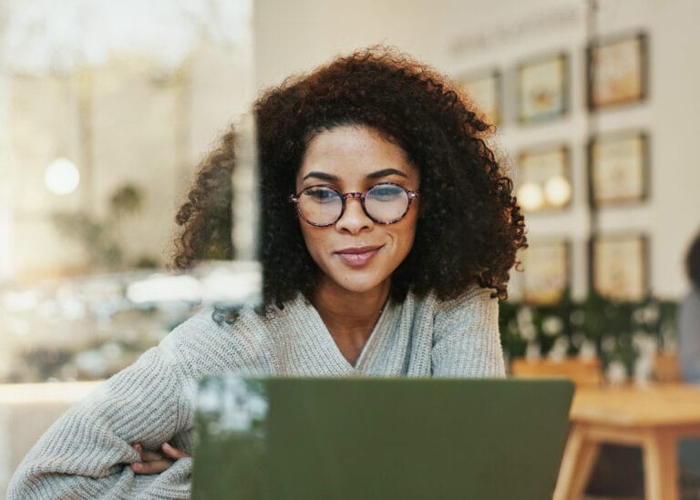 Remote working, online woman with laptop in a cafe